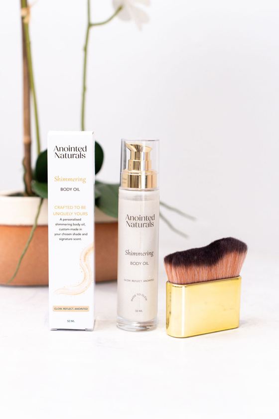 Shimmering Body Oil with its box and application brush
