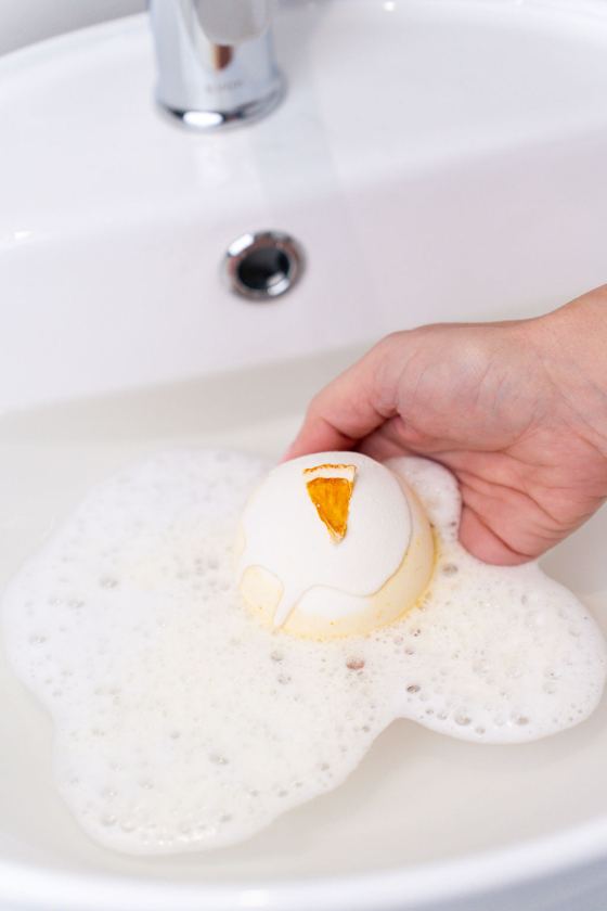A bath bomb fizzing in the basin