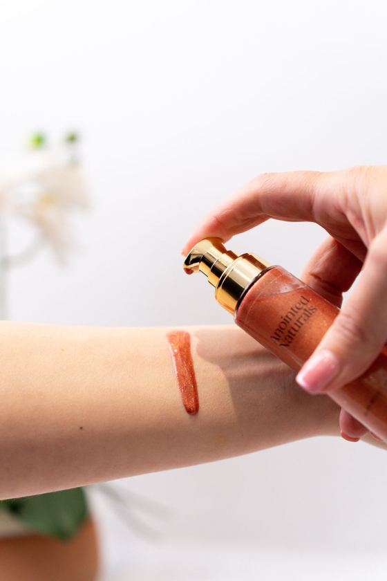 Shimmering body oil swatch on the wrist